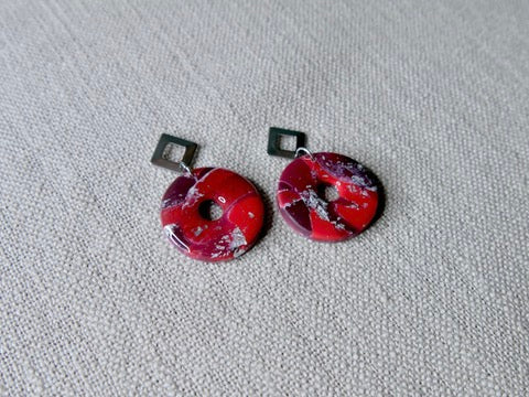 Red circles with silver piece